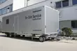 EagleBurgmann mobile on-site service container parked on company premises, ready for maintenance and repair of sealing systems.